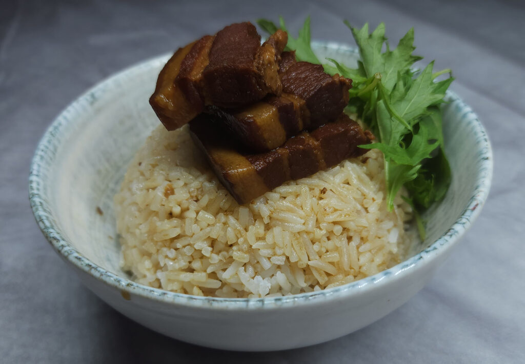 Steamed rice with honey soy pork belly sauce