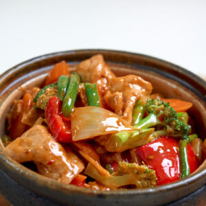Stir fried pork loin slices with Sichuan chilli, ginger spring onion sauce and vegetables (mild spice) (GFO)