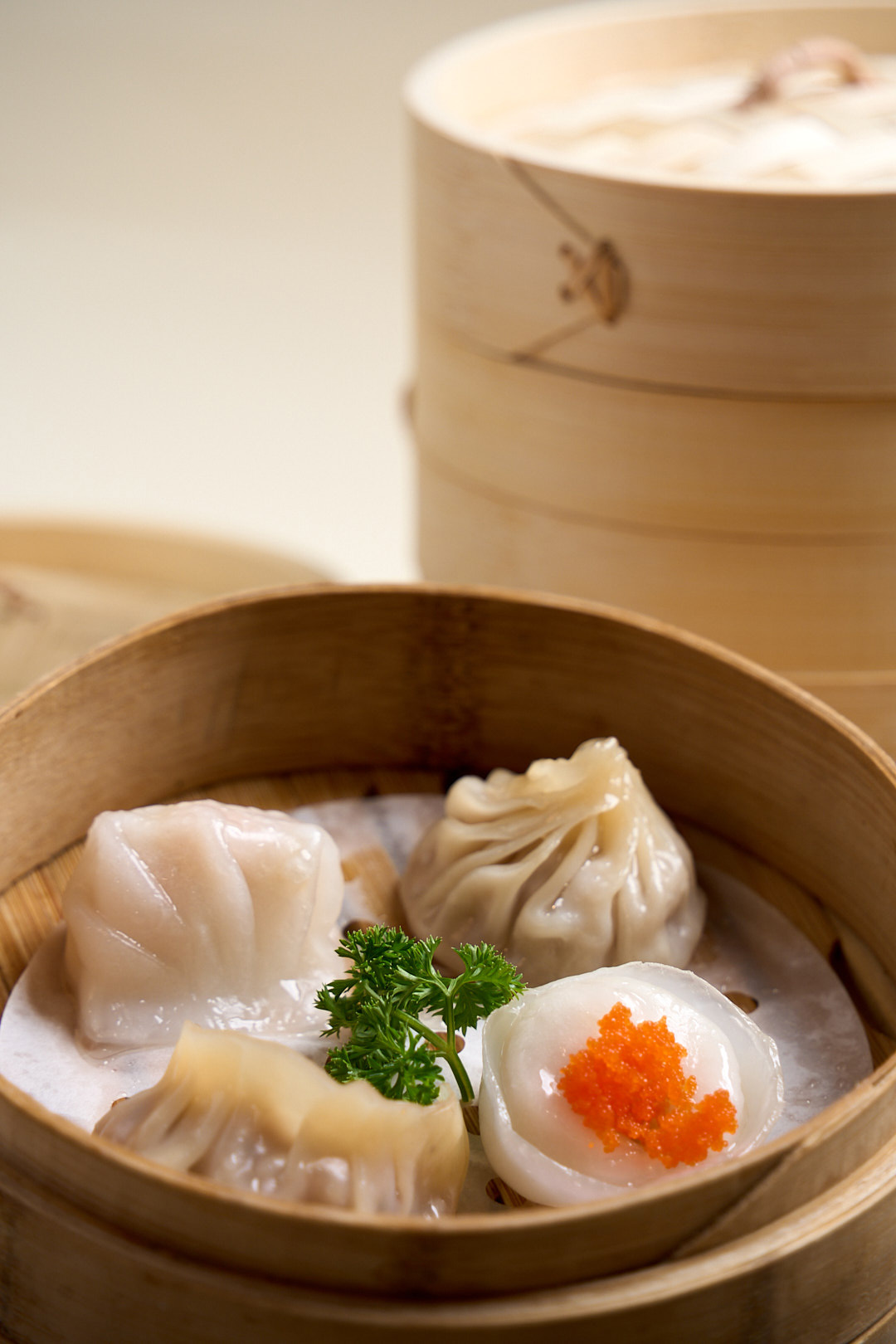 Steamed dumplings platter with scallops, prawns, wagyu champagne & soup pork